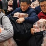 Chinese Boss Drops $26 Million In Cash At End Of Year Party, Tells Employees To Take As Much As They Can Carry